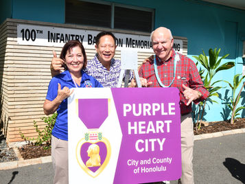 A Purple Heart City sign dedication ceremony was held on December 22, 2025 at the 100th Infantry Battalion Veterans Clubhouse in Honolulu, recognizing the city's commitment to honoring those wounded or killed in service —and paying tribute to the Hawaii-born 100th Infantry Battalion, known in WWII as “The Purple Heart Battalion.”