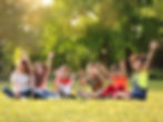 children-sitting-together-in-a-sunny-park-2026-03-27-02-59-15-utc.jpg