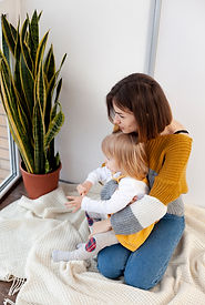 Professional live-in nanny assisting toddler with learning