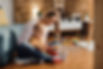 happy-mother-son-playing-with-toy-blocks-living-room.jpg