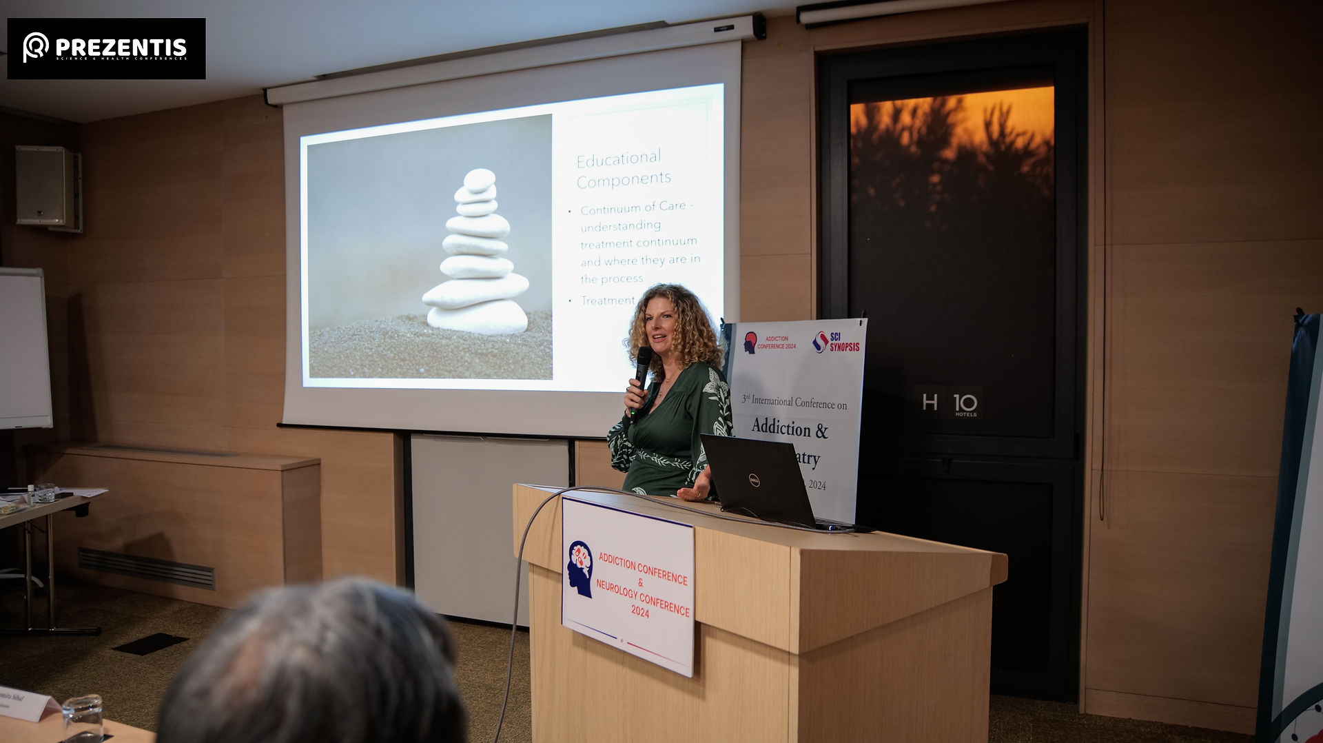 Woman speaks to international scholars at the 3rd Annual International Addiction and Psychiatry Conference
