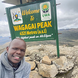 Selfie at Wagagai Peak sign, 4321m on Mt. Elgon after 4-Day Hike Bushiyi trail