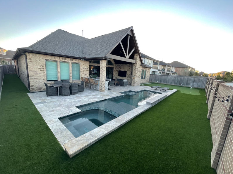 Luxury home backyard with pool and TurfTex