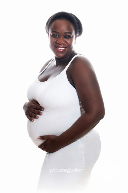 Beautiful deep brown skin Smiling pregnant woman in white dress holding her belly, dream light , Beautiful deep brown skin, Photo session Sunset Lakes