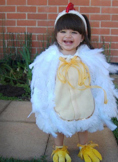 Smiling young girl in a white chicken costume, In-Home photo shoot at Miami , Doral