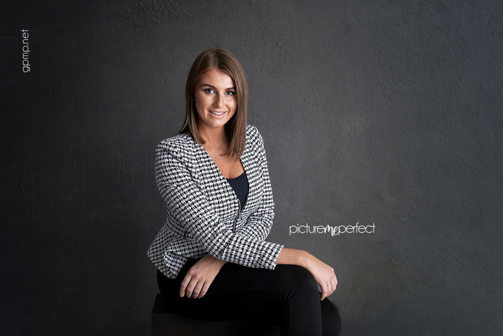 Smiling professional woman in blazer, Fontainebleau,The Beach Club