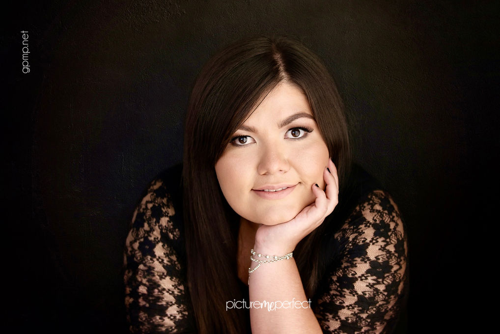 Smiling young woman in black lace, photo taken at Windmill Ranch Estates