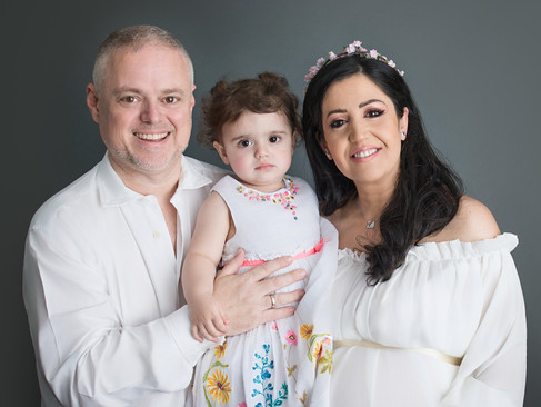 Family portrait. Final edit sample removing cloth wrinkles on white
