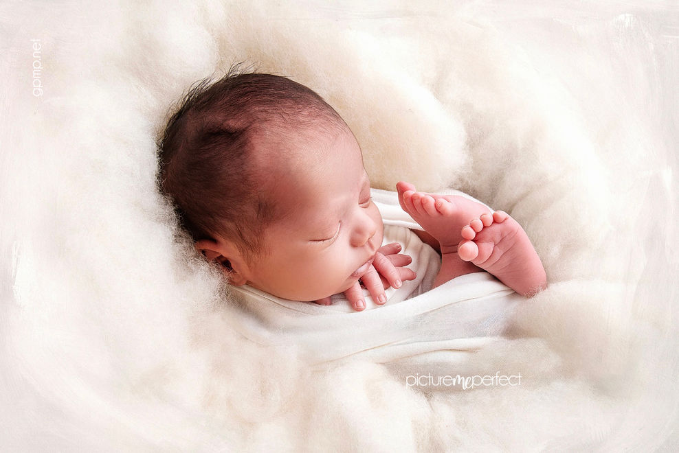 Sleeping newborn baby  boy on soft white blanket. Miami photo shoot  at Savanna