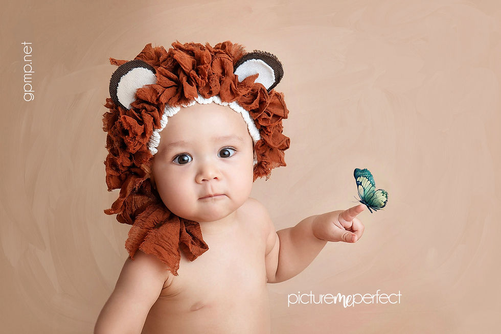 Baby wearing a bear bonnet during a Miami sitter session milestone photography experience, photo shoot at his home in Westfork , miami