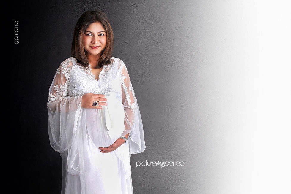 Pregnant woman in white dress smiling, Tamiami,West Kendall