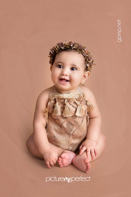 Happy sitting baby girl , 7-10 months, in ruffled gold outfit, Miami Lakes,Loch Lomond photo session