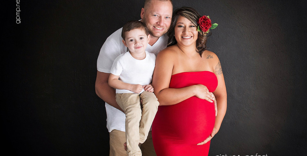 Smiling family with pregnant woman in red dress, In-Home photo session at Miami, Coral Gables,Granada Golf Course area