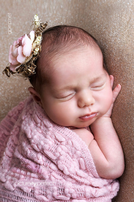 Sleeping newborn baby girl with gold sparks beige blanket and flower headband. Miami Lakes,Cypress Village
