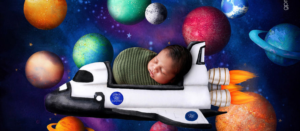 Space-themed newborn photography in Miami featuring a sleeping newborn baby posed in a rocket ship surrounded by planets and stars.