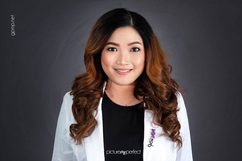 Smiling IV doctor woman with long brown hair in a white lab coat, Miami Lakes,The Anchorage photo shoot at her clinic