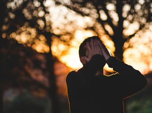 Man holding his head due to stress.