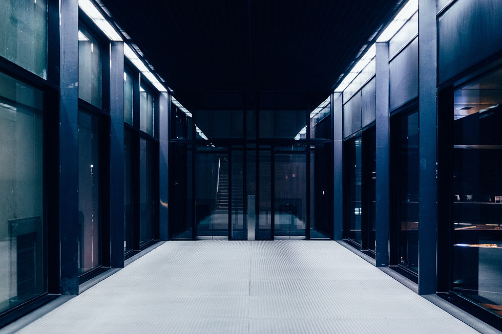 Dark server room with rows of illuminated server racks, representing AI cloud infrastructure, large-scale data centers, and enterprise computing.