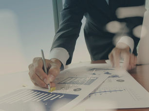 A man signing documents.