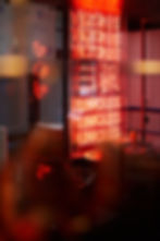 a photo of three uncles neon sign