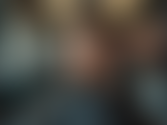 Close-up of a barber cutting a man's hair with precision in a modern tekniques salon