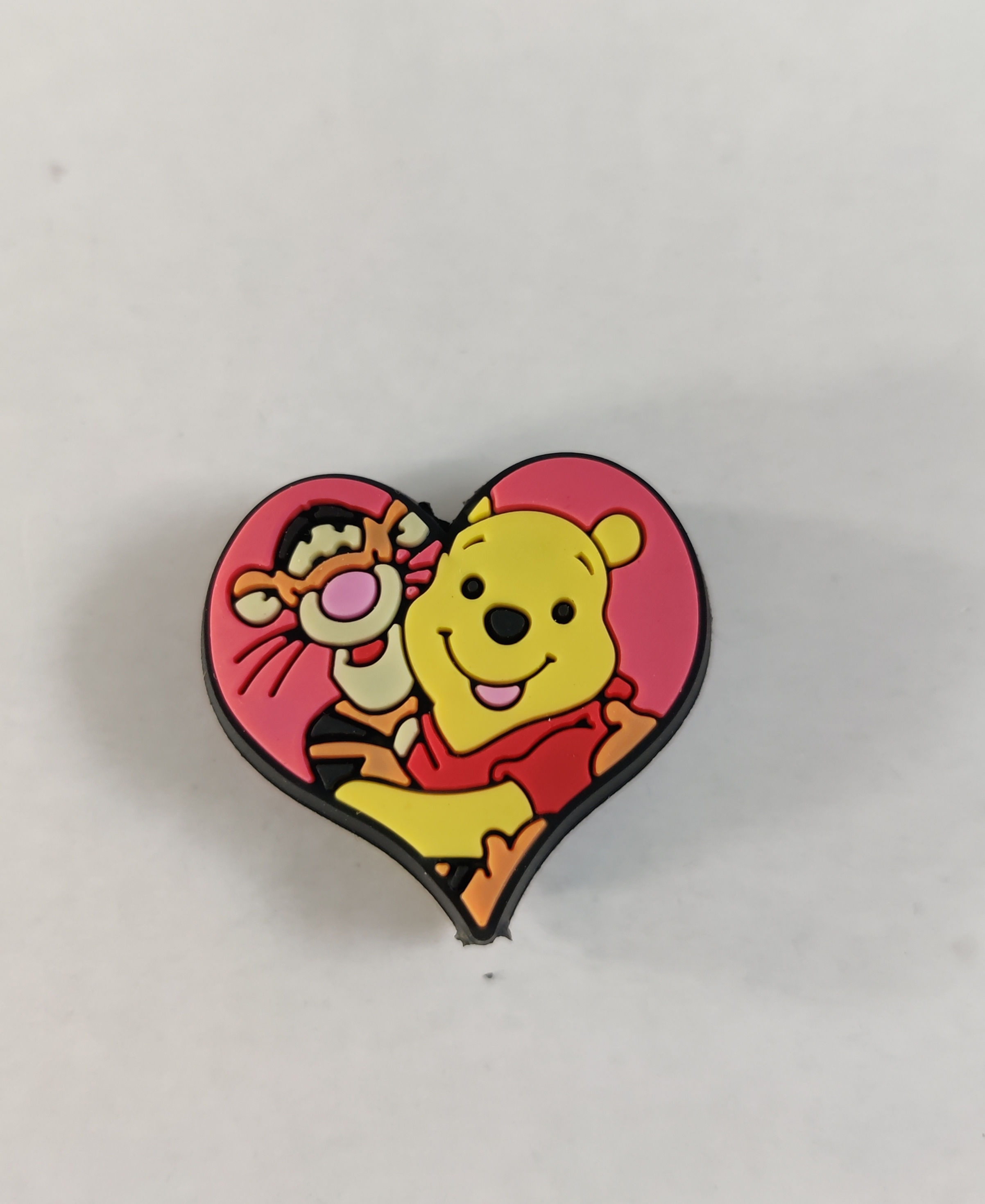 Looks similar to Winnie & Tigger in a heart hugging silicone focal bead
