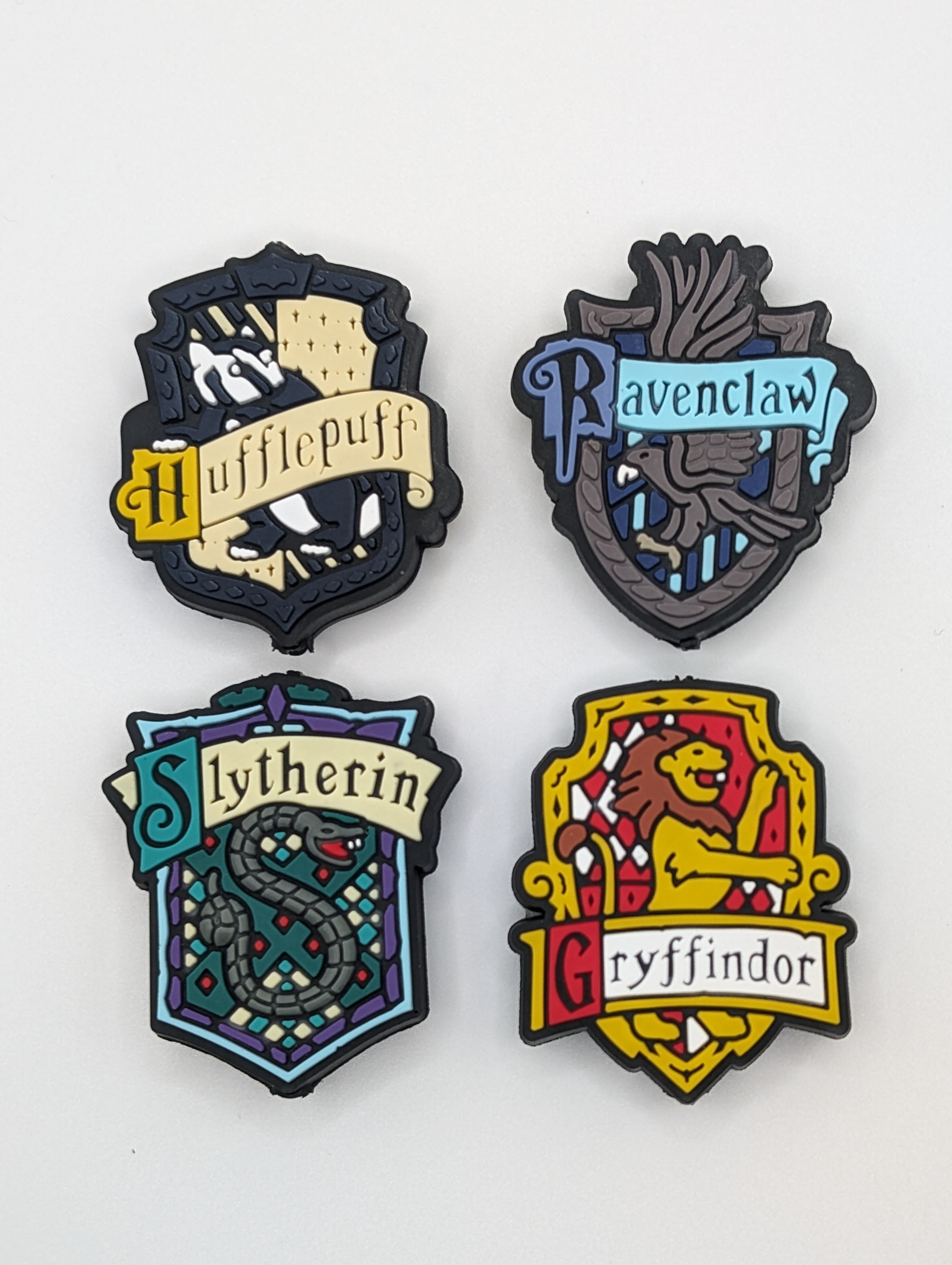 Harry Potter - Hogwarts crests - Gryffindor, Slytherin, Hufflepuff, & Ravenclaw