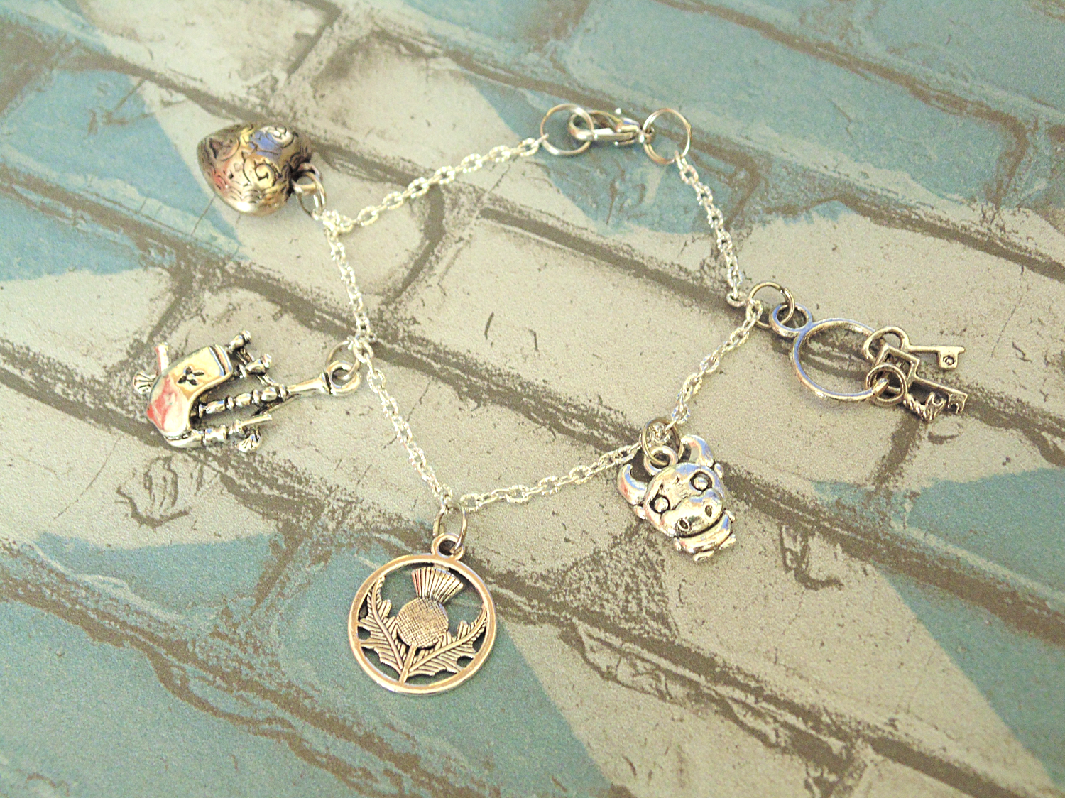 Outlander inspired bracelet Scottish thistle Lallybroch key cow heart bagpipe