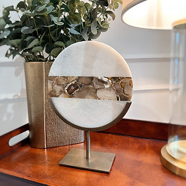 GOUYA marble sculpture cream/bronze styled on a side table