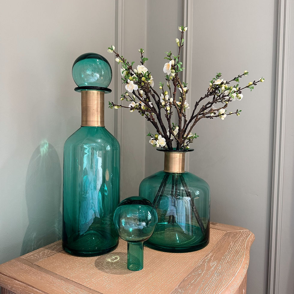 Jorum Collection Wide Glass Bottle with Lid Brass Detail styled with some stems.