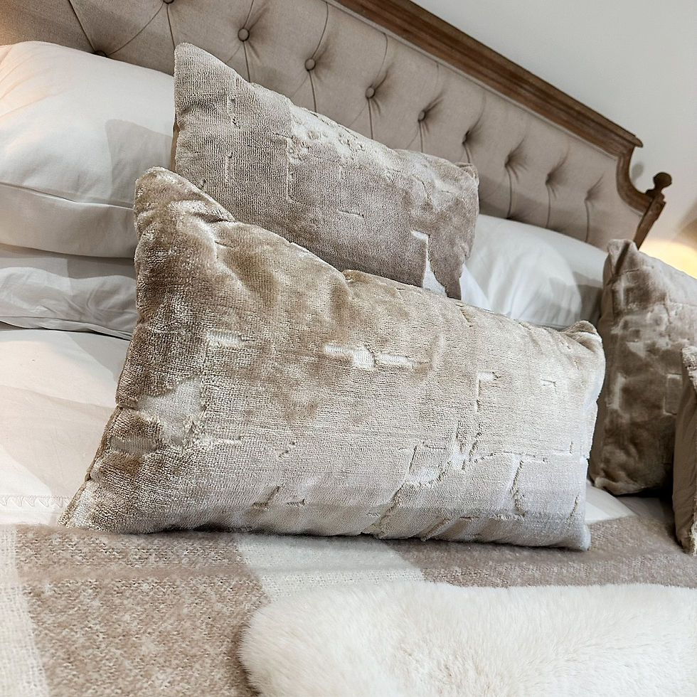 Thumbnail: HUSLIA beige cushion styled on a bed with the matching rectangular version. 