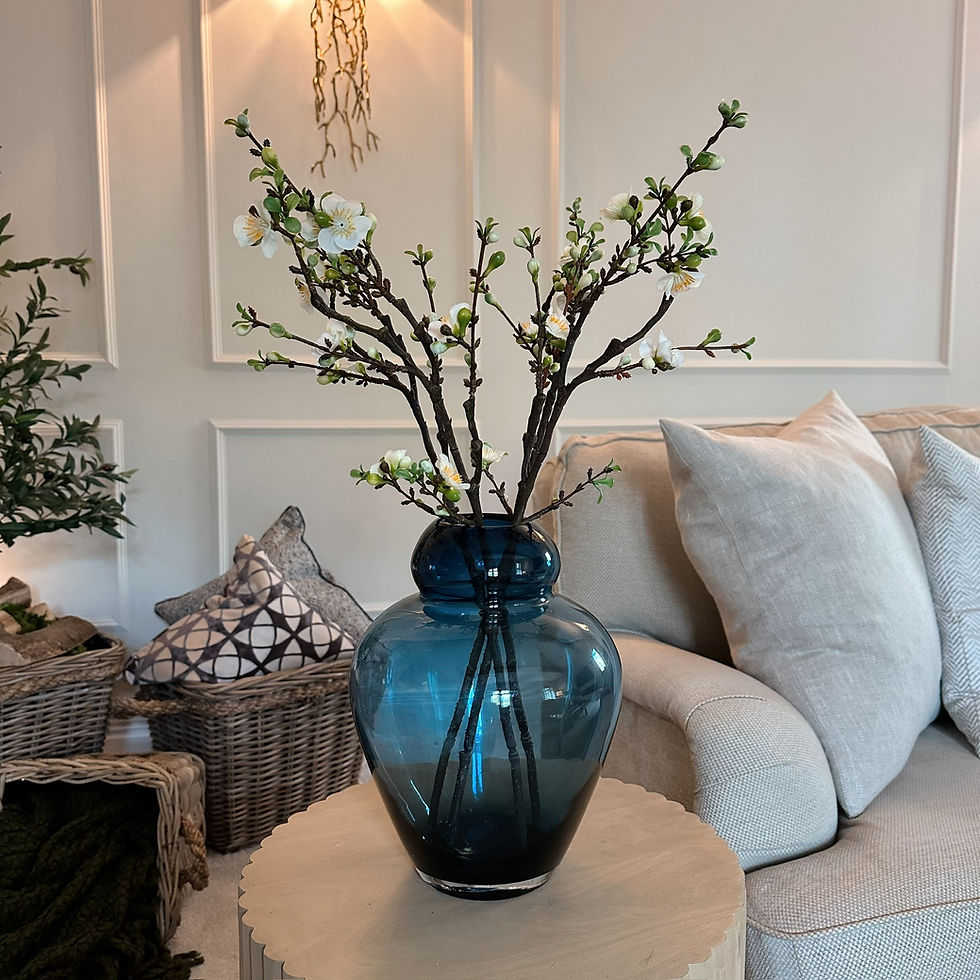 Thumbnail: Opaque Blue Glass Vase styled with some cherry blossom branch stems on a console table.