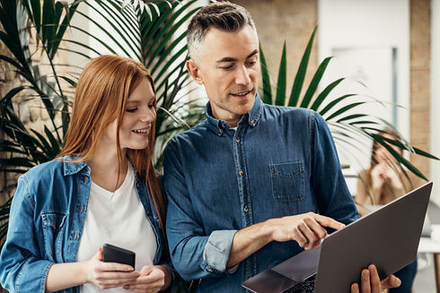 man-showing-something-laptop-his-coworker.jpg