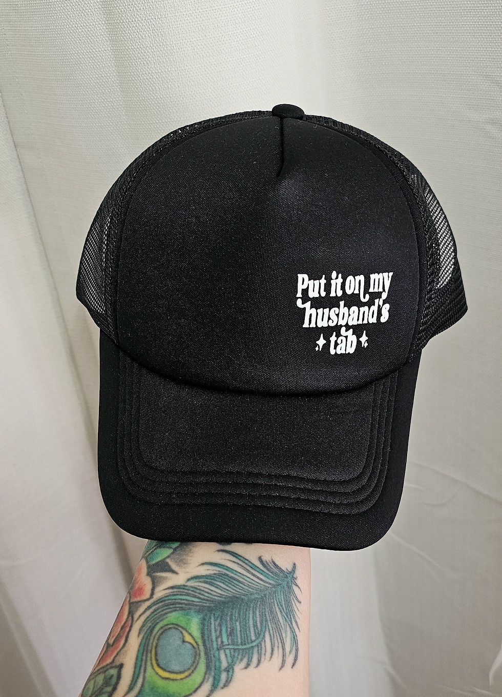 Put It On My Husband's Tab Trucker Cap