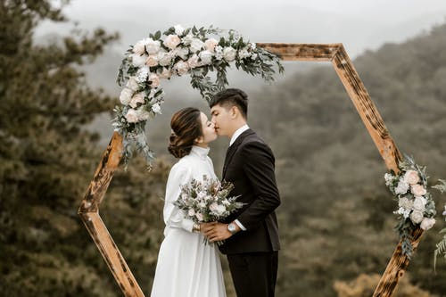 Kissing bride and groom