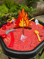 fire-themed sensory play tray for children with tools and props