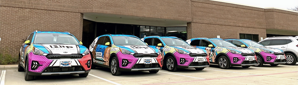 Colorful cars with comic-style designs are parked outside a brick building. Visible text includes "Hip Realty Group" and a phone number.