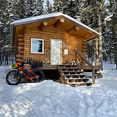 Fat bike in front of a cabin