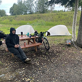 Bikepacker next to campsite