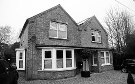 The front of Meadowgate in Emneth, Norfolk as seen form the adjacent highway and showing its nineteenth century vernacular.