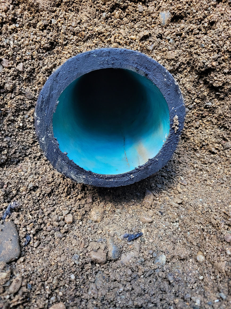 Eye-level view of a clean sewer pipe interior after pipe-lining