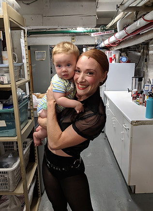 Nili w baby Tennyson backstage at CHICAG