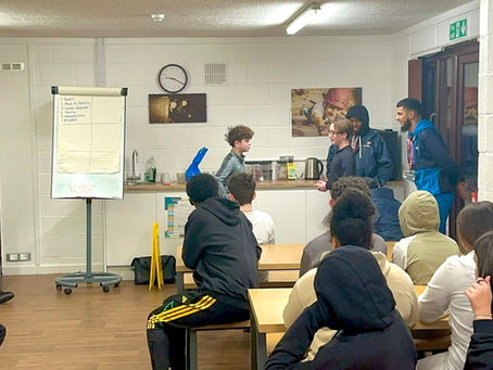 Young people attending the 21UP Movement residential programme at Stubbers Adventure Centre learning teamwork and communication skills.