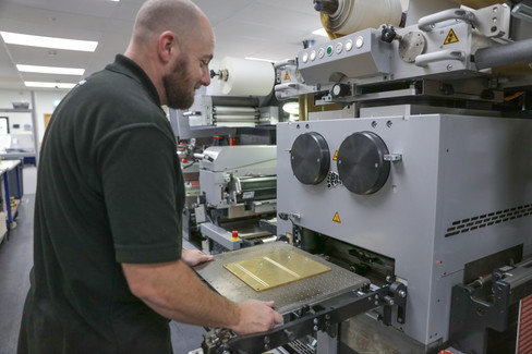 Baker Labels staff operating advanced digital printing machines showcasing sustainable and innovative manufacturing