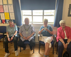 Witham Mayor Councillor Paul Heath at the Royal British Legion Cinema Club with 3 other attendees, all sat on chairs