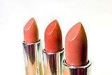 3 lipsticks with their lids off