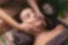 Beautiful young woman receiving massage in spa salon.jpg
