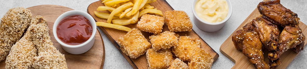high-angle-chopping-boards-with-fried-chicken-nuggets-sauces_edited.jpg