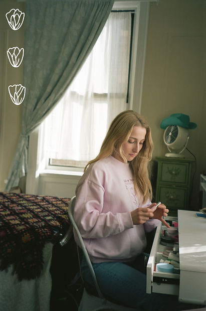 maddy at desk w tulips.jpg