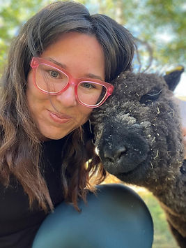 Ellen Boucher hugging a babydoll sheep